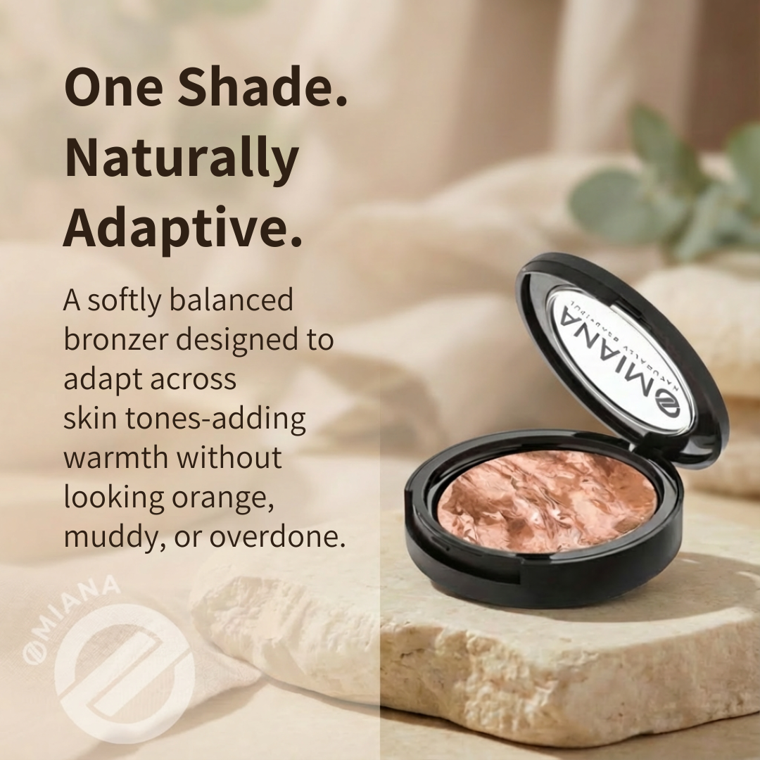 Omiana bronzer compact on a stone with text describing its adaptability.